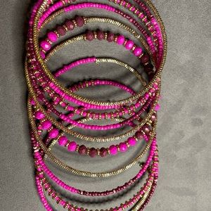 Bracelet with reds pinks maroon’s and some gold